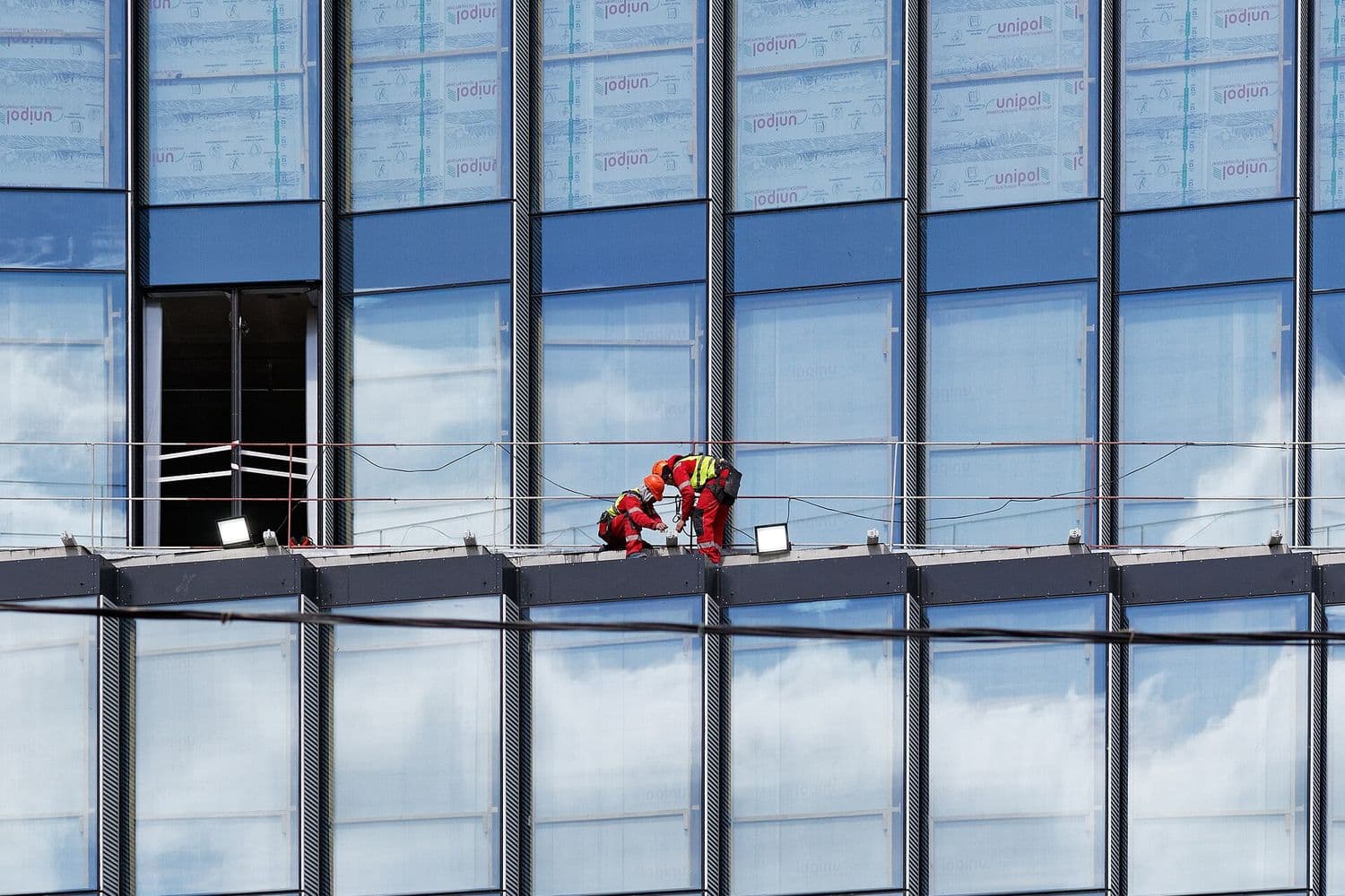Workers on a high-rise construction site